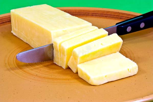 Cheddar Cut into Blocks on a Brown Plate. Stock Image - Image of mature,  dinner: 24387289