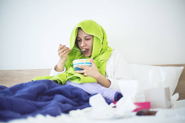 Eating Chicken Noodle Soup In Bed While Sick Stock Photo - Download Image  Now - 2015, Adult, Adults Only - iStock