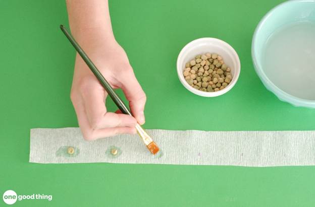 Use a slurry of cornstarch and some toilet paper or tissue paper to make your own seed tape.