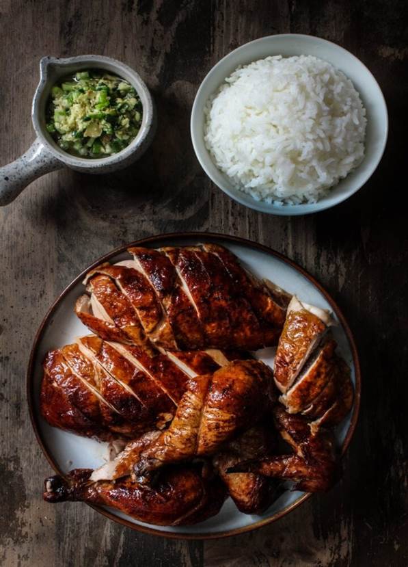 Peking chicken served with a bowl of rice and ginger scallion sauce